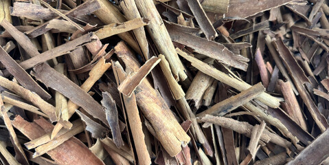 Broken Ceylon Cinnamon Textured Background, Cinnamomum Verum Bark Pieces Pattern