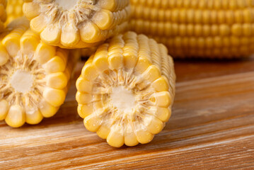 Sweet corn ears closeup. Fresh maize cob macro texture, autumn sweetcorn, corncob close up