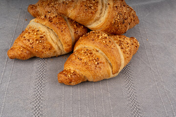 Delicious croissant with nut crumbs, sweet French bakery