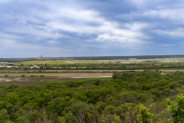 Naklejka premium View of Missouri River, Omaha Nebraska skyline and Omaha Eppley Airfield, Interstate 29. View from Council Bluffs, Iowa. 