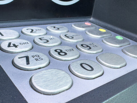 Close-up image of atm keypad with numeric buttons