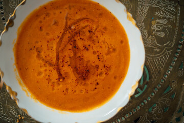 bowl of red lentil soup with aleppo pepper