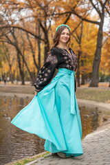 Naklejka premium Portrait of a young beautiful woman in Russian folk clothing