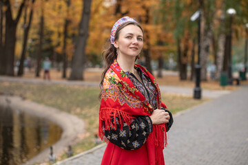 Fototapeta premium Portrait of a young beautiful woman in Russian folk clothing
