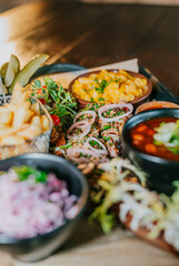 A table full of food with a variety of dishes including macaroni and cheese