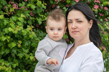 Middle aged mother and her infant daughter
