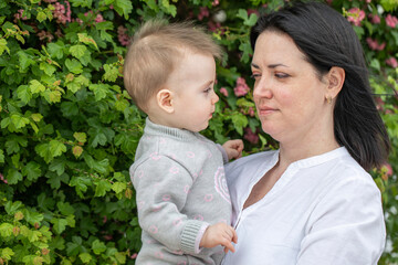 Middle aged mother and her infant daughter