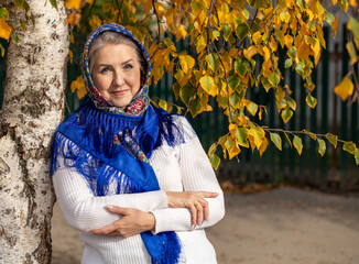 Close up portrait of a middle-aged woman in a headscarf