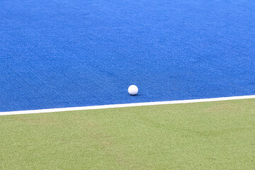 Hockey ball on an artificial grass field