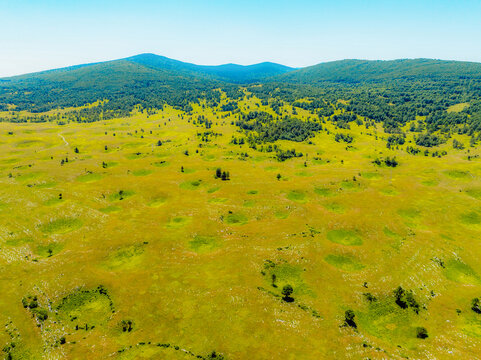 Fototapeta Sinkholes in the Bravsko Polje karst landscape near Bosanski Petrovac  the Federation of Bosnia and Herzegovina