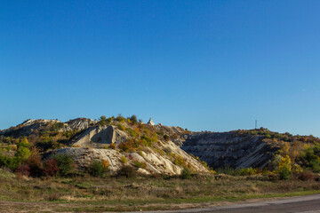 Fototapeta premium An autumn landscape with a road in northern Moldova, through wooded and mountainous terrain.