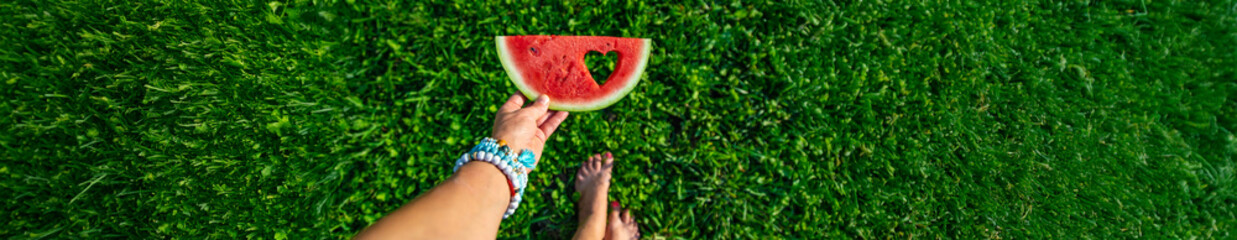 A heart-shaped piece of watermelon. Selective focus.