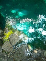 Emerald Water and Mossy Rocks