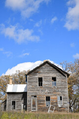 Abandoned weathered wood farmhouse