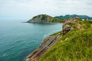 Itzurun Beach in Zumaia Surrounded by the Cliffs of the Basque Flysch