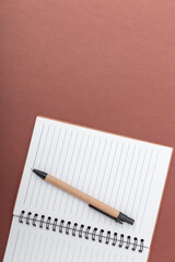 Notebook and pen on a desk. Concept of planning, creativity and daily organization.