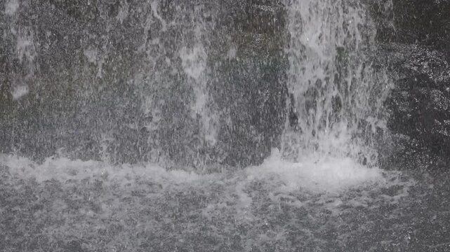 Beautiful waterfall streams flowing down the cliff in slow motion. Calm in nature, an ideal abstract video for relaxation, spa, travel, advertising projects. 120 fps ProRes 422 10 bit C-LOG video.