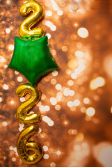 golden sign saying 2026 with bokeh background