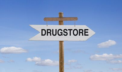 White wooden arrow with the inscription: Drugstore