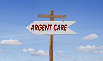 White wooden arrow with the inscription: Argent care