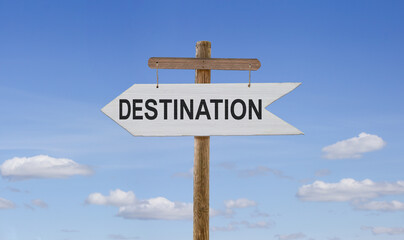 White wooden arrow with the inscription: Destination