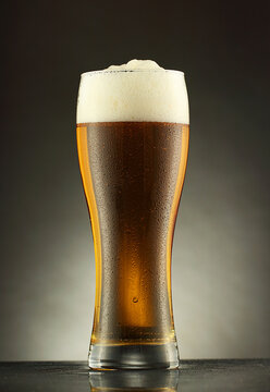 a glass mug with beer in drops