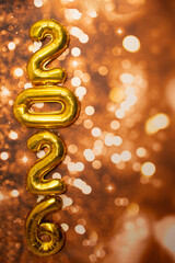 golden sign saying 2026 with bokeh background