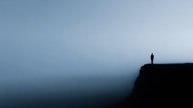 minimal silhouette of person standing on cliff, dream and journey theme
