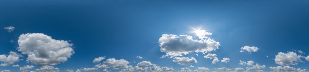 Seamless cloudy blue sky hdri panorama 360 degrees angle view with zenith and beautiful clouds for use in 3d graphics or game development as sky dome or edit drone shot