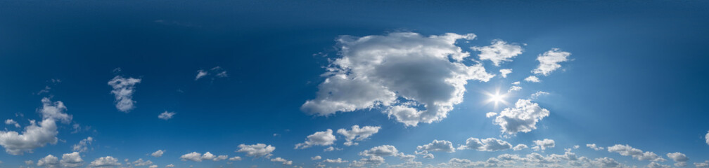 Seamless cloudy blue sky hdri panorama 360 degrees angle view with zenith and beautiful clouds for use in 3d graphics or game development as sky dome or edit drone shot