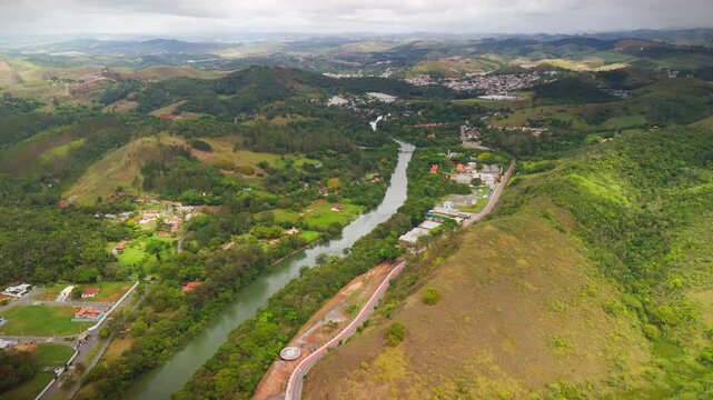 aerial view of Guararema town in the countryside of Sao Paulo state in Brazil with green and astonishing forest with Paraiba do Sul river
