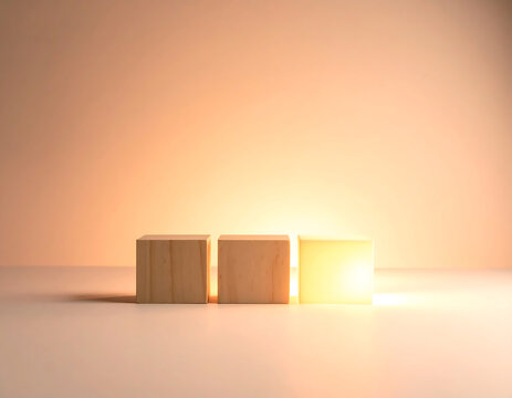Three wooden blocks are arranged in a row, illuminated by a warm, bright light source from behind, creating a soft, minimalist composition.