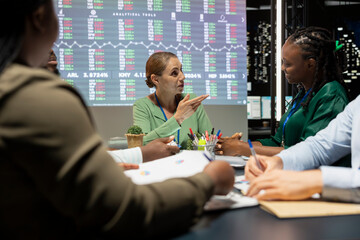 Team of corporation employees preparing a pitch for the shareholders meeting, finding ideas to...