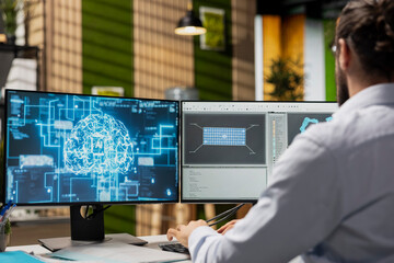 Technician in office working for renewable energy company using artificial intelligence to develop solar panels. Worker using AI tech to manufacture eco solar panel assembly workflows
