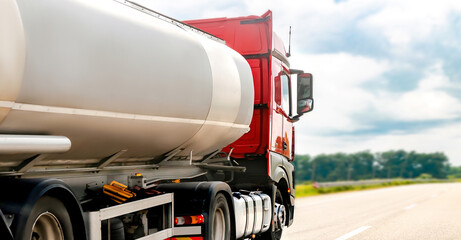 Petrol cargo truck lorry tanker driving on highway hauling oil products.Fuel delivery...