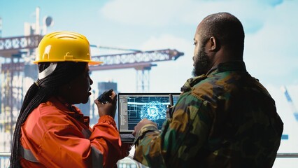 Fototapeta premium Military unit on offshore rig using artificial intelligence automated counter terrorism systems. Soldier provides protection to drilling barge using AI neural network surveillance systems