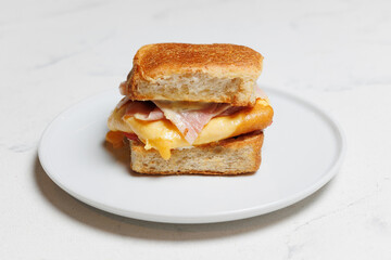 Delicious Ham and Cheese Grilled Sandwich on a White Plate