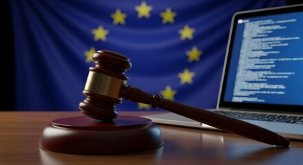 European union digital law concept with gavel and laptop displaying code