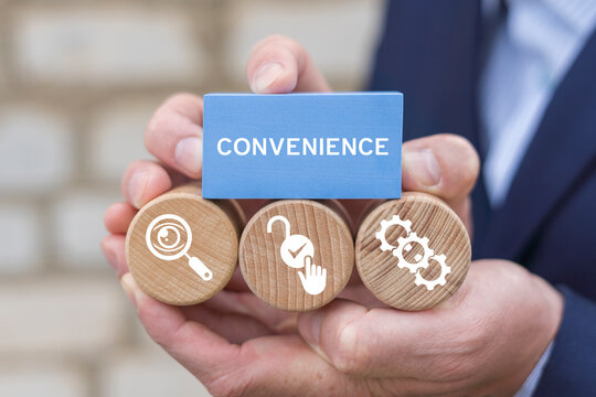Convenience Business Data Technology concept. Person holding blocks with icons sees the word CONVENIENCE.