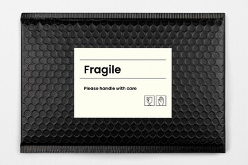 Black bubble mailer bag, fragile label, shipping packaging design