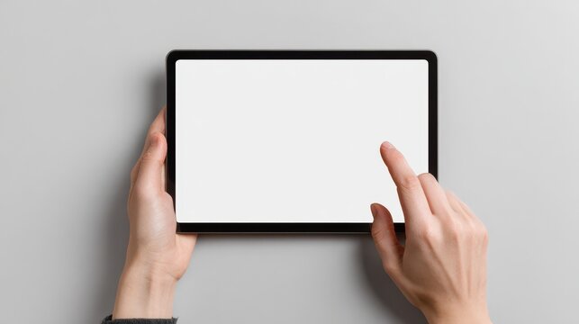 Blank tablet held and tapped by hands over light grey background. Ideal for showcasing app interfaces, touch gestures, or responsive designs.