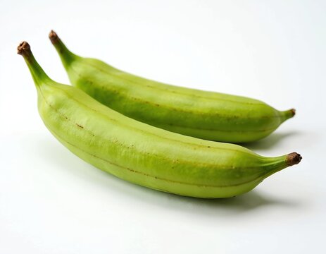 Two long green Inga edulis pods, commonly known as Guama fruit, displayed closeup on clean white background. Tropical, healthy fruits raw, edible, offer sweet taste, perfect for vegan diets.