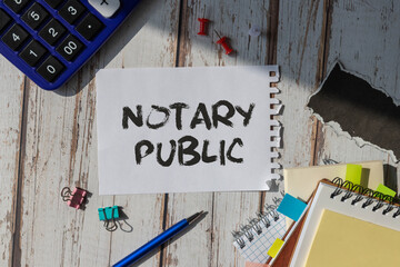A notebook with the text NOTARY PUBLIC