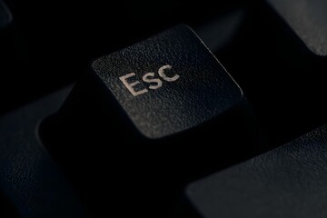Macro Close-Up of ESC Key on Mechanical Keyboard &ndash; Textured Black Keycap with White Lettering in Low-Light 4K Horizontal Composition