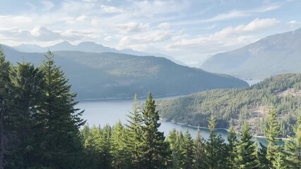A camera pan an amazing view showing a place with lot of trees pine a lake of Ross Lake North Cascades National Park. USA, Washington july 18 2025