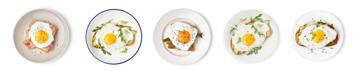 Set of tasty sandwiches with fried eggs on white background, top view