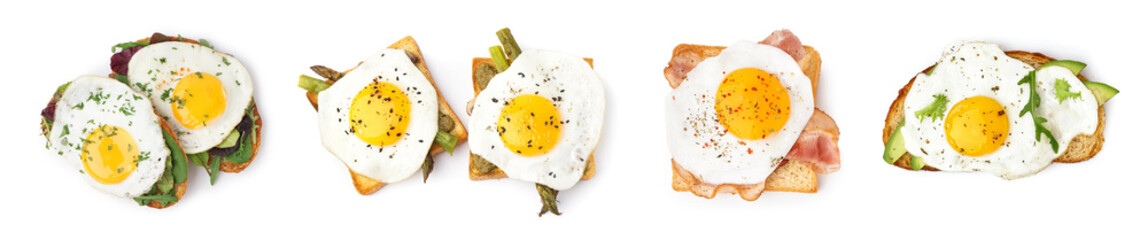 Set of tasty sandwiches with fried eggs on white background, top view