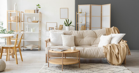 Interior of modern light living room with sofa and table