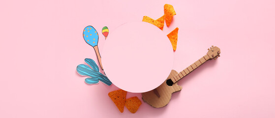 Composition with blank card, tasty nachos and paper decor on pink background. El Dia de Muertos