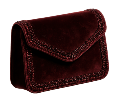 Handcrafted velvet clutch featuring beaded accents and a magnetic closure.